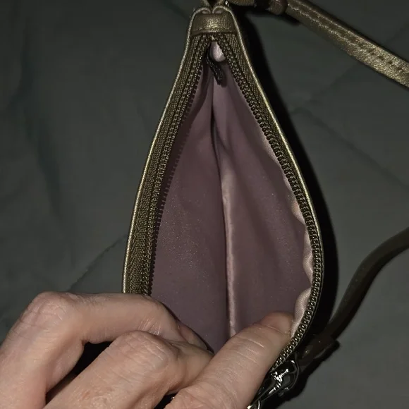 Coach metallic bronze wristlet featuring a detachable strap and a embossed logo - Picture 7 of 7